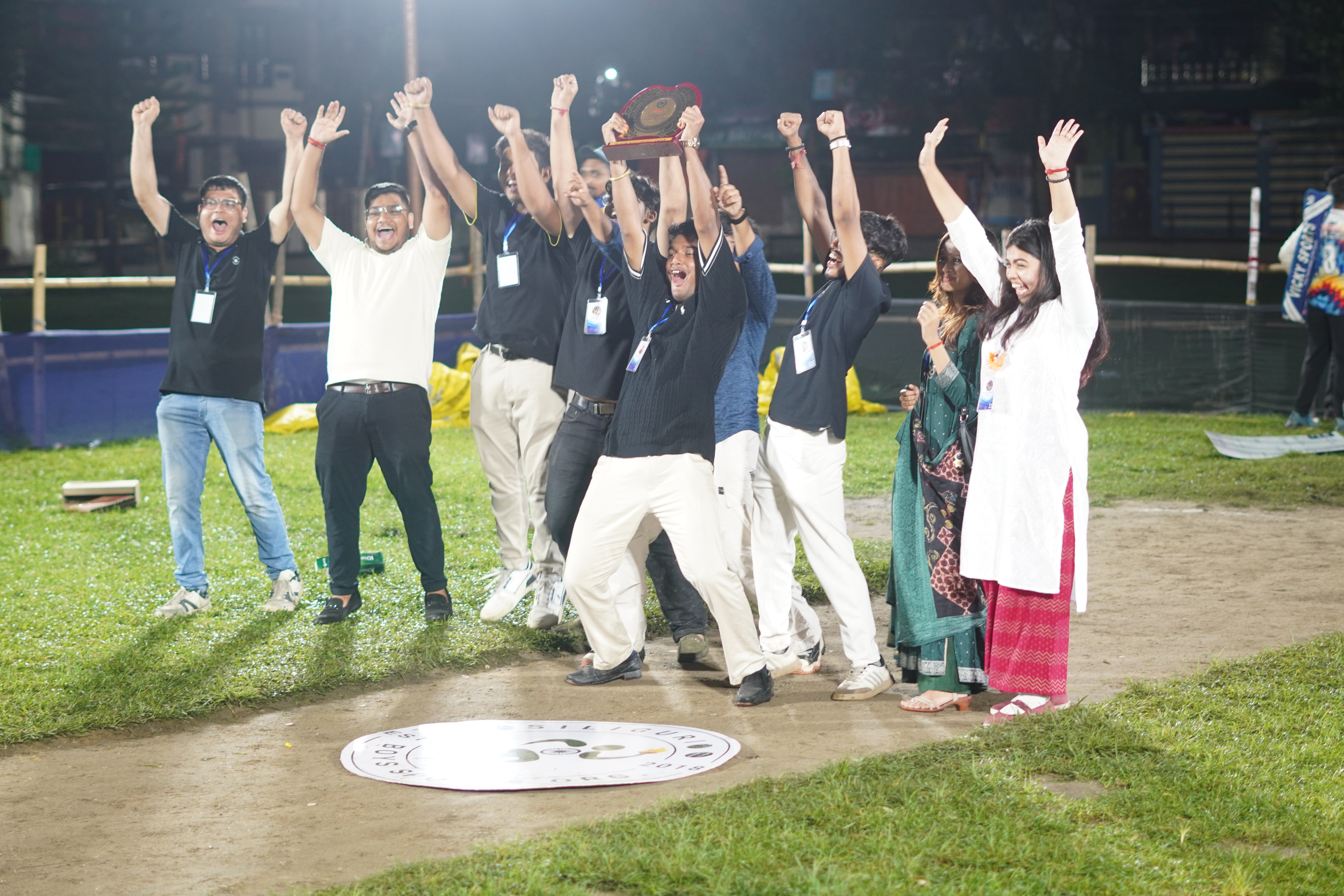 Young bowlers strategising with coach